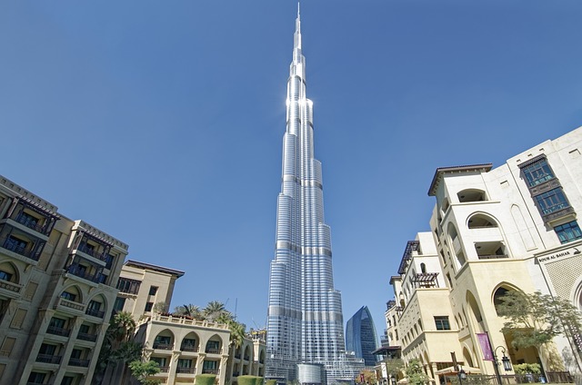 Iconic Burj Khalifa towering in Dubai against a vivid blue sky, Burj Khalifa towering in Dubai against a vivid blue sky,