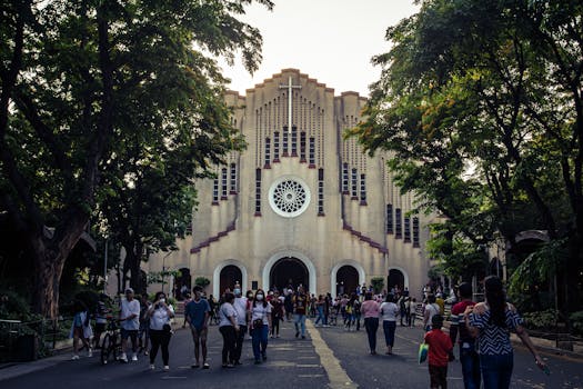 Crowd in front of St. Andrew&#039;s Cathedral, Parañaque, NCR, Philippines, during daytime.